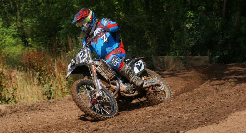 Adult rider cornering on the sand